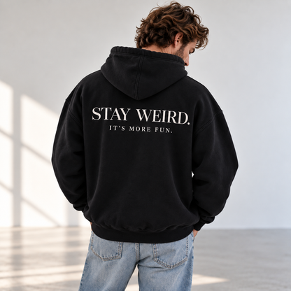 Hoodie premium Black pour homme avec design blanc STAY WEIRD. IT’S MORE FUN. au dos, L’ATELIER 514.